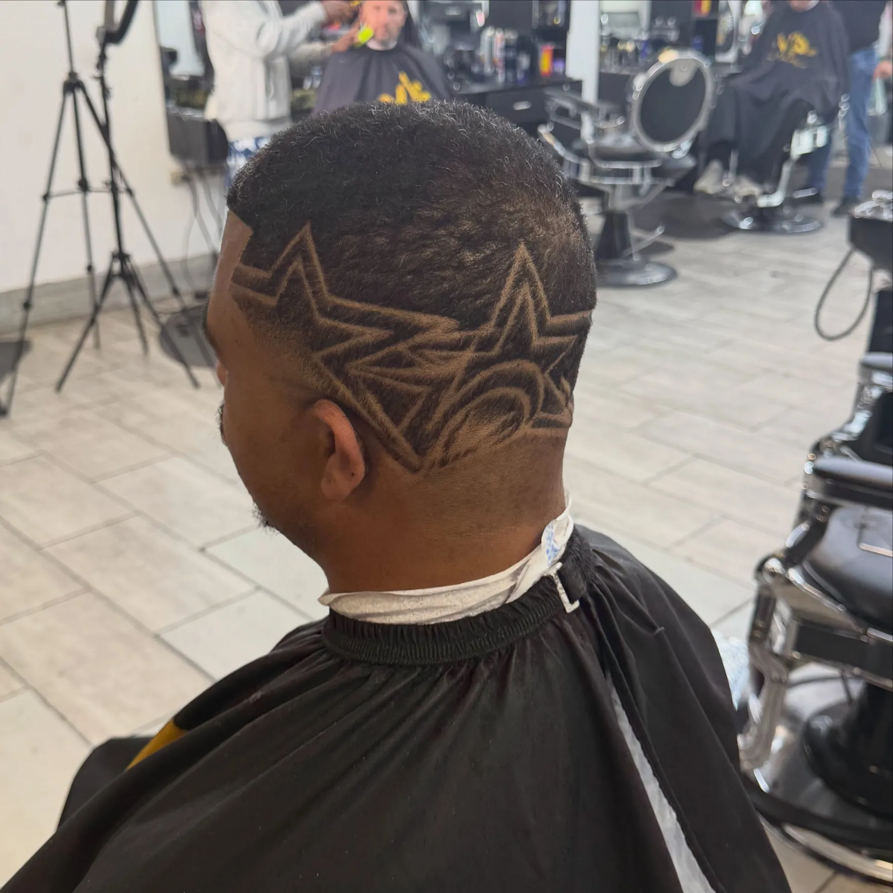 Freehand star design cut into a fade at VIP Barber Lounge, Denver & Aurora