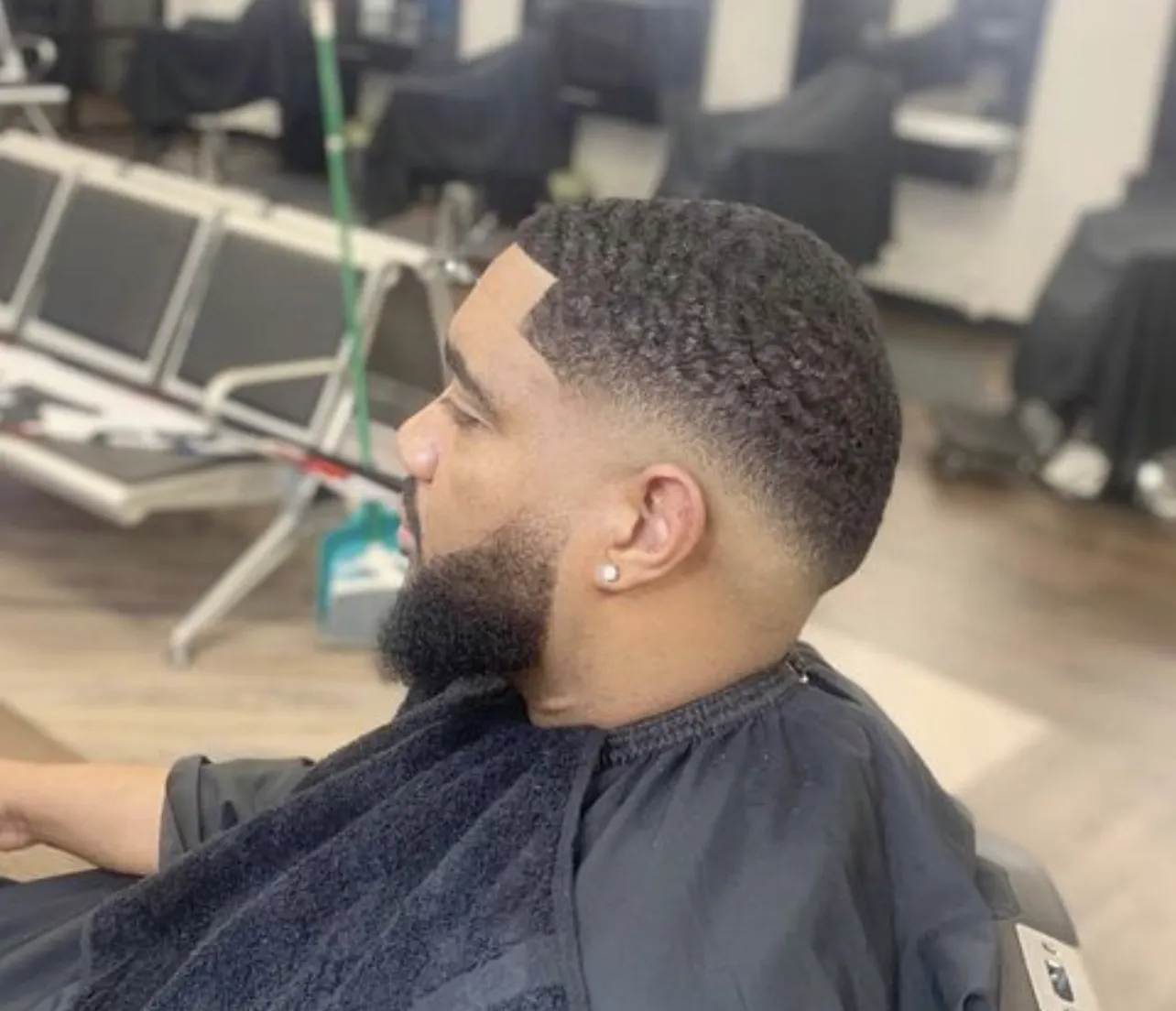 Skin fade with a full beard at VIP Barber Lounge Denver