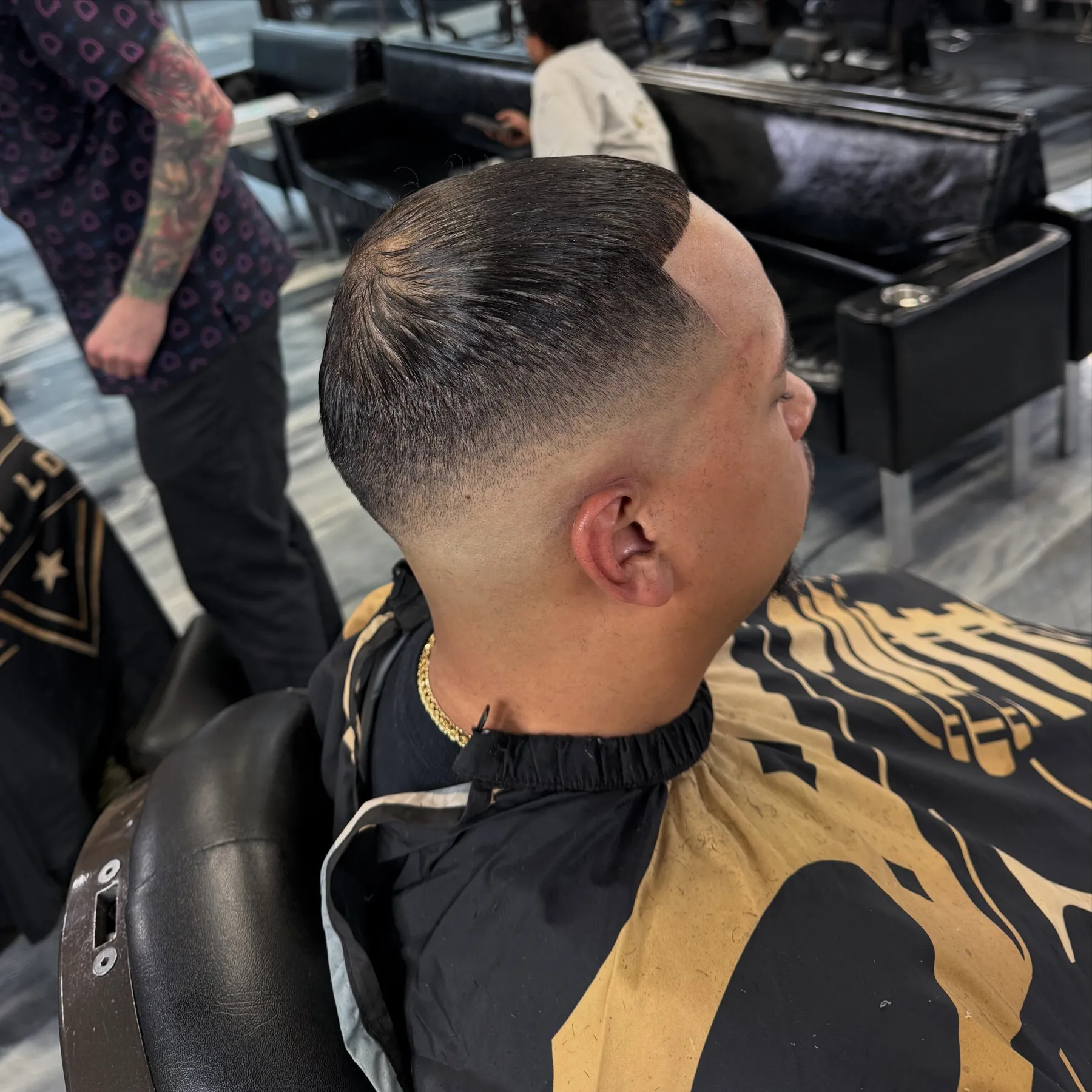 Mid fade with a textured top at VIP Barber Lounge, Denver & Aurora